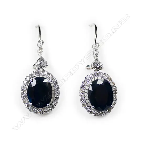 A pair of 14ct white gold sapphire and diamond antique style halo drop earrings,