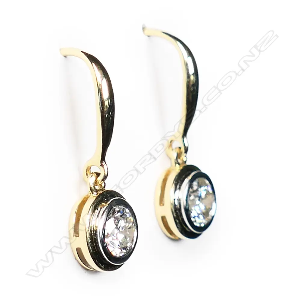 A pair of 18ct white gold and diamond solitaire earrings, Image 1++