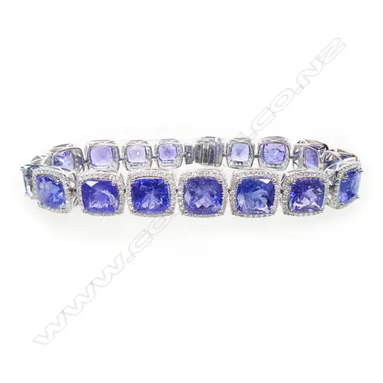 A 14ct white gold tanzanite and diamond halo bracelet,