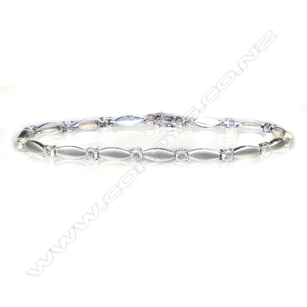 An 18ct white gold and multi diamond bracelet, Image 1++