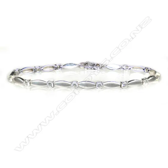 An 18ct white gold and multi diamond bracelet,
