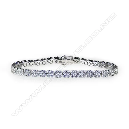 An 18ct white gold and diamond tennis bracelet,