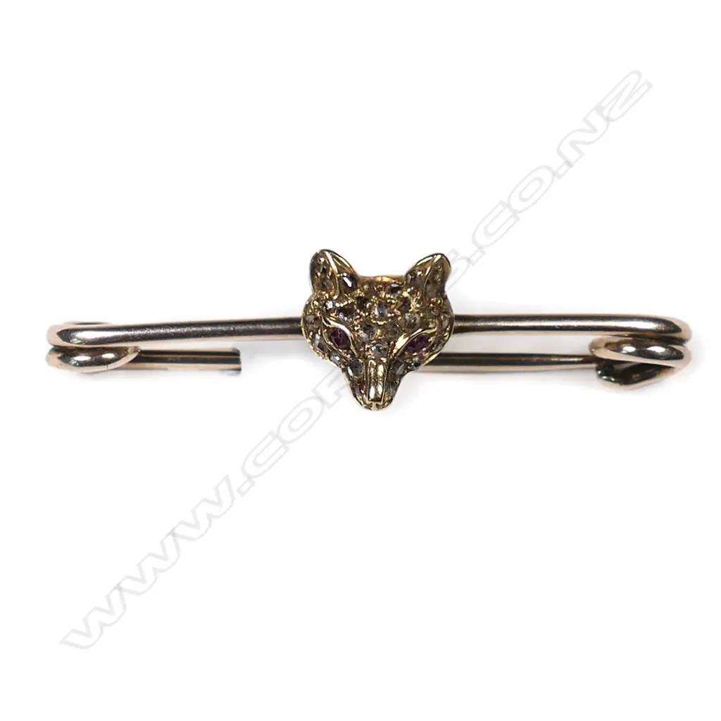 A vintage gold and diamond set fox head bar brooch, Image 1++