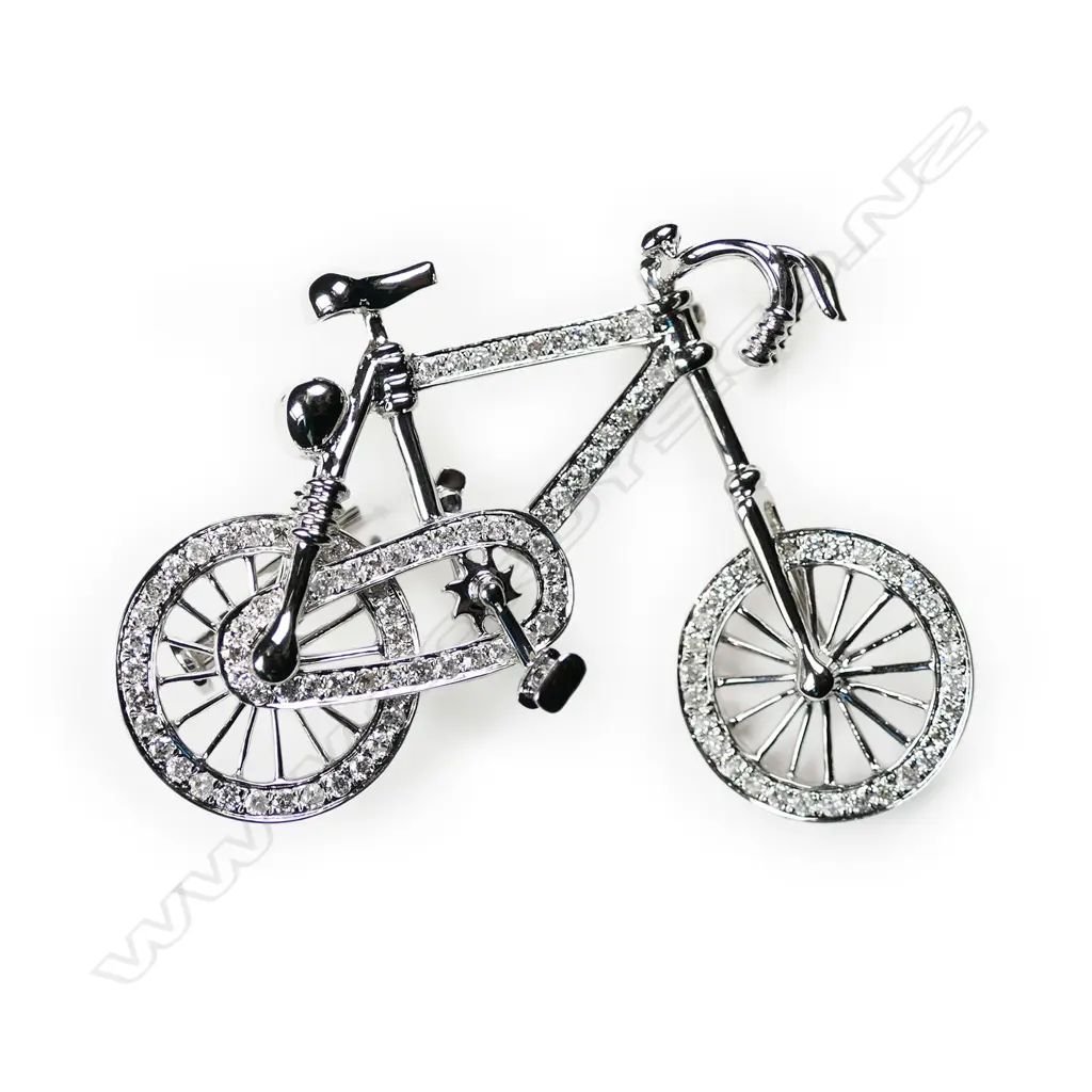 An 18ct white gold and diamond bicycle, brooch Image 1++