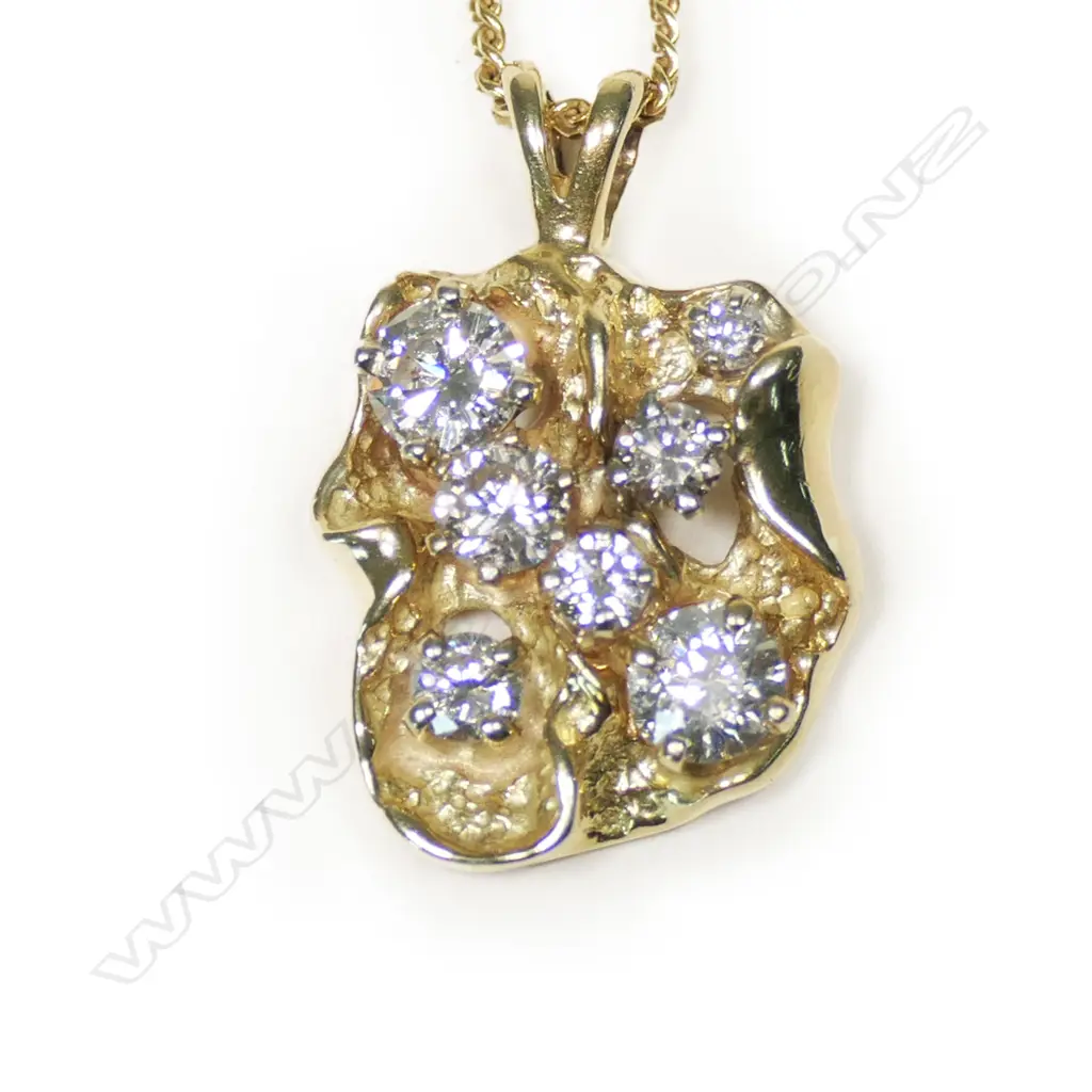 A 14ct gold and diamond pendant, Image 1++