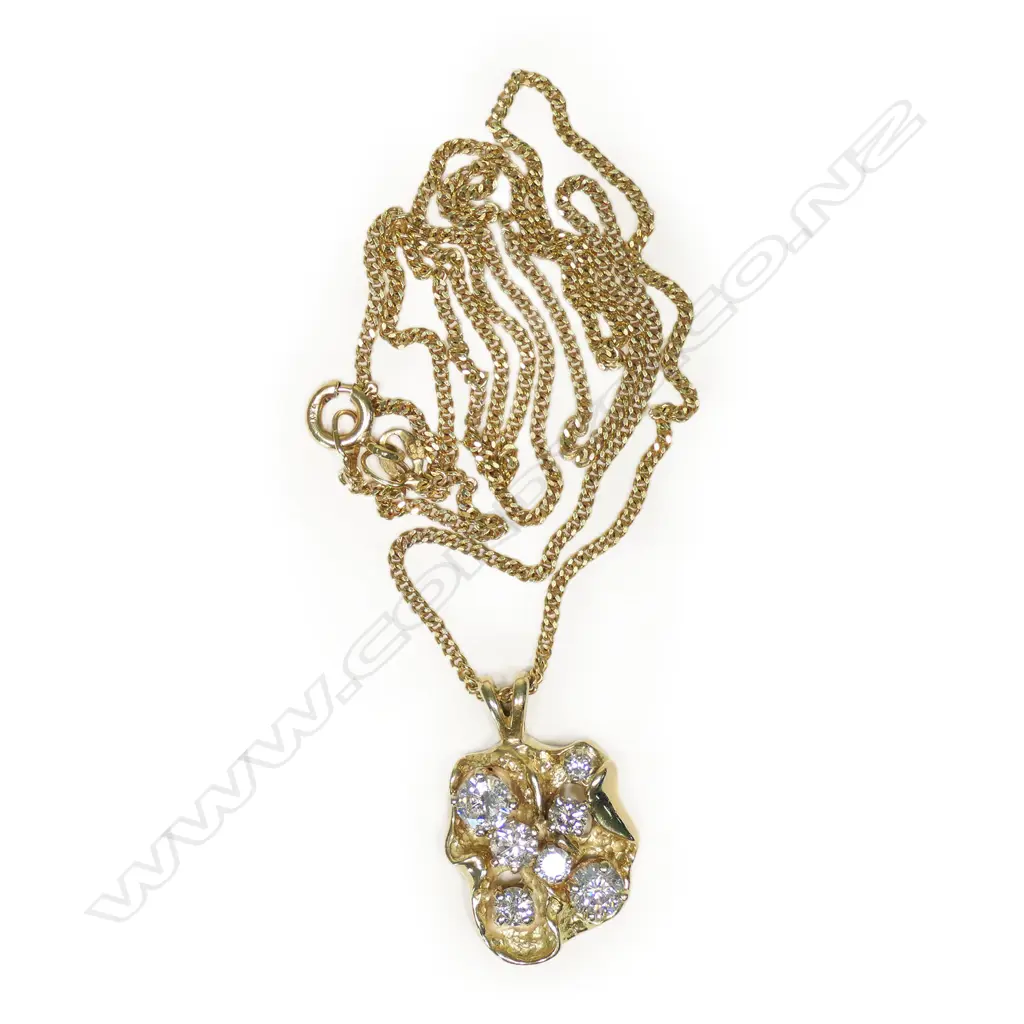 A 14ct gold and diamond pendant, Image 1++