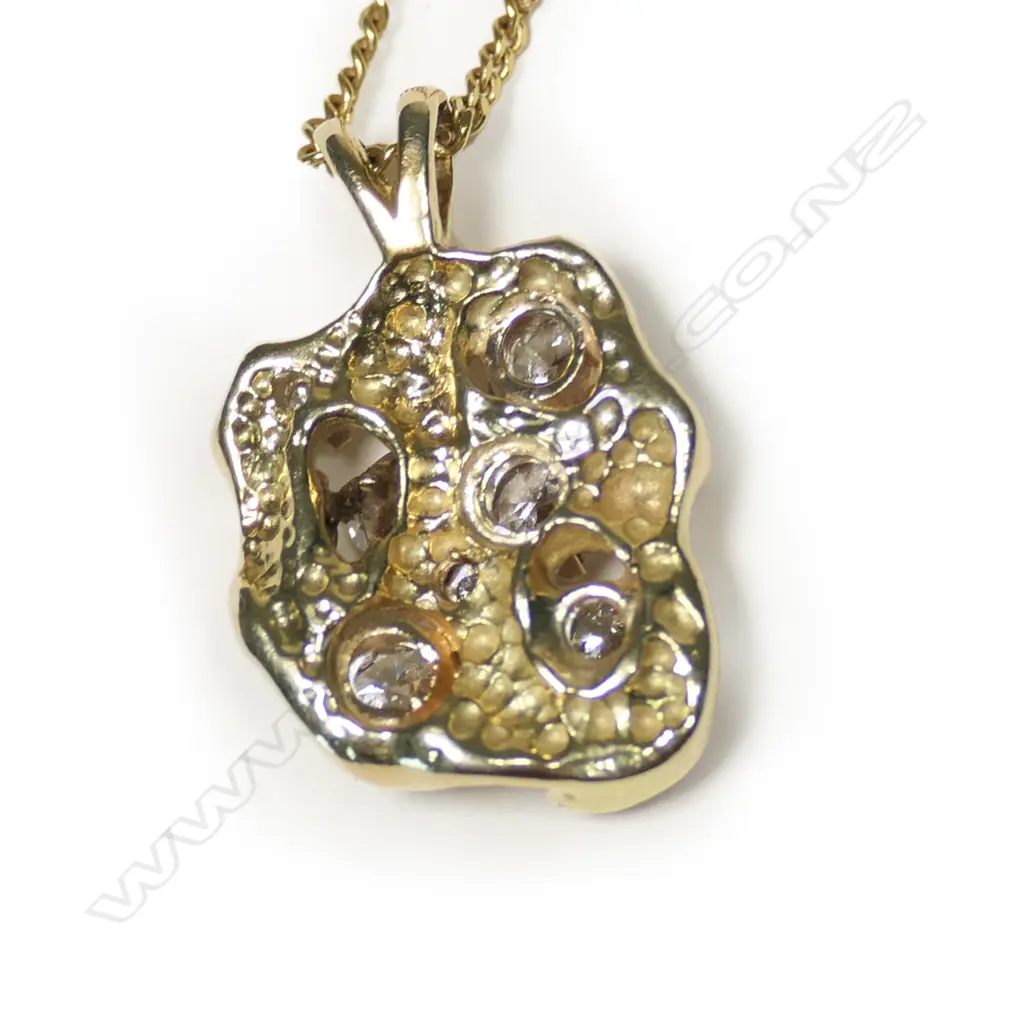 A 14ct gold and diamond pendant, Image 1++