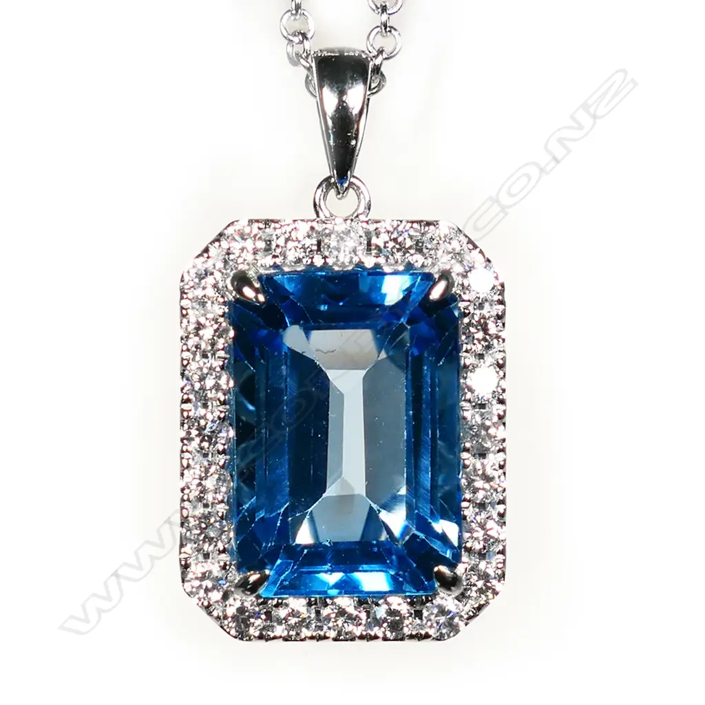 An 18ct white gold topaz and diamond cluster pendant on 18ct white gold chain, Image 1++