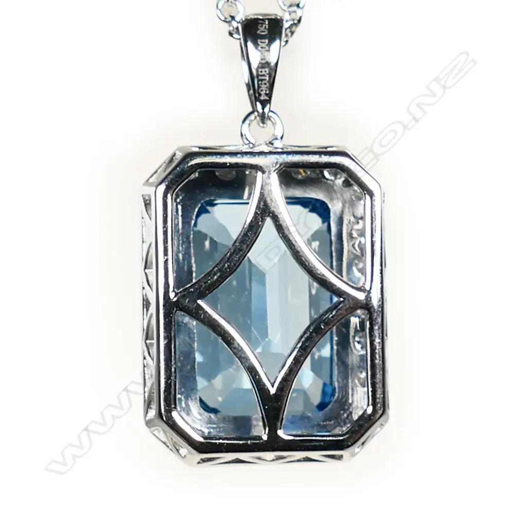 An 18ct white gold topaz and diamond cluster pendant on 18ct white gold chain, Image 1++