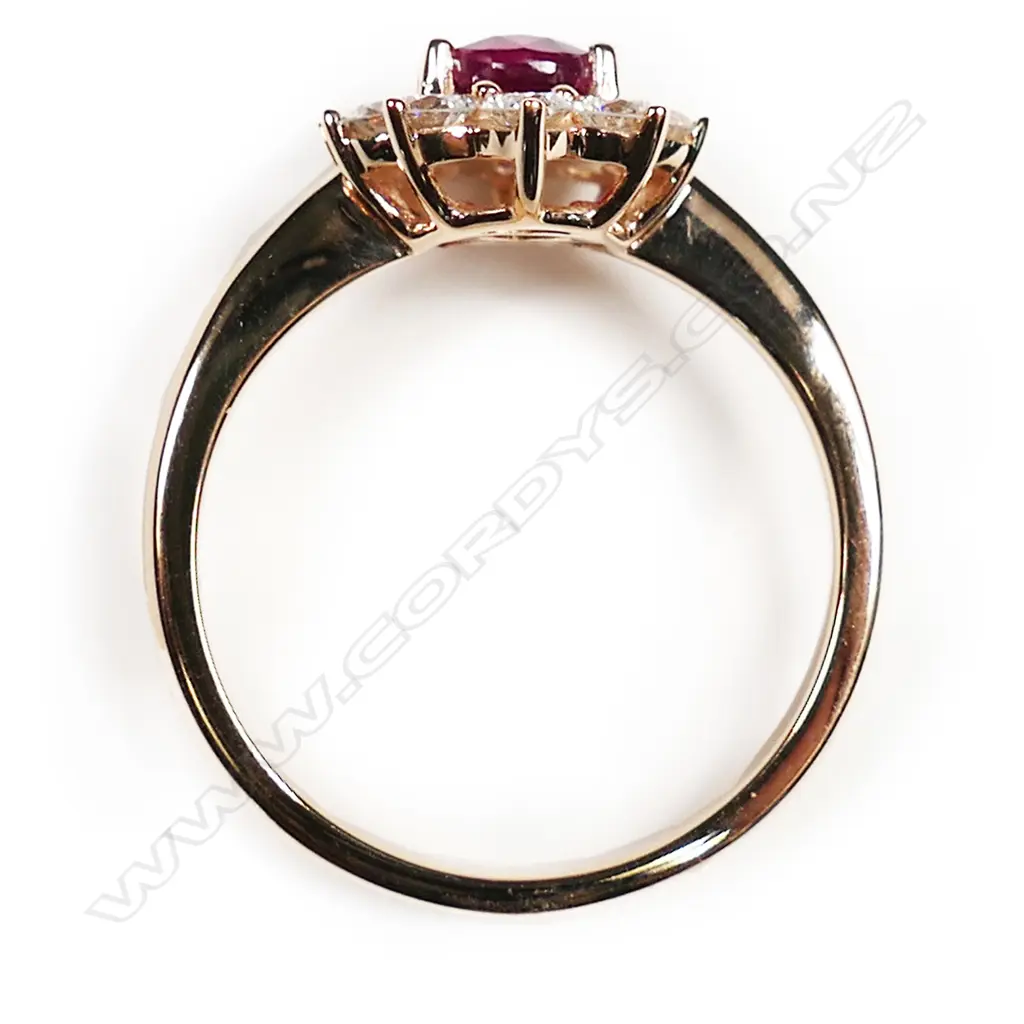 An 18ct rose gold ruby and diamond cluster ring, Image 1++
