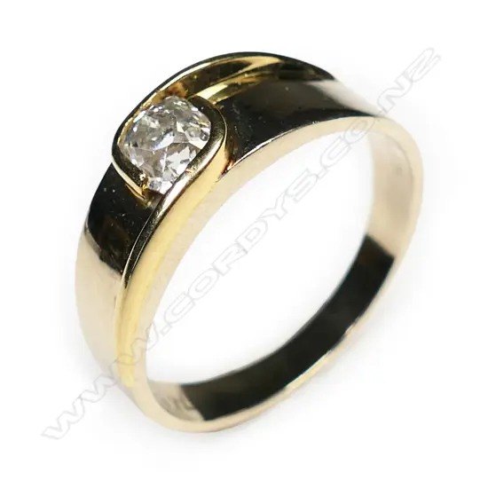 A modern 18ct yellow gold and solitaire diamond ring,