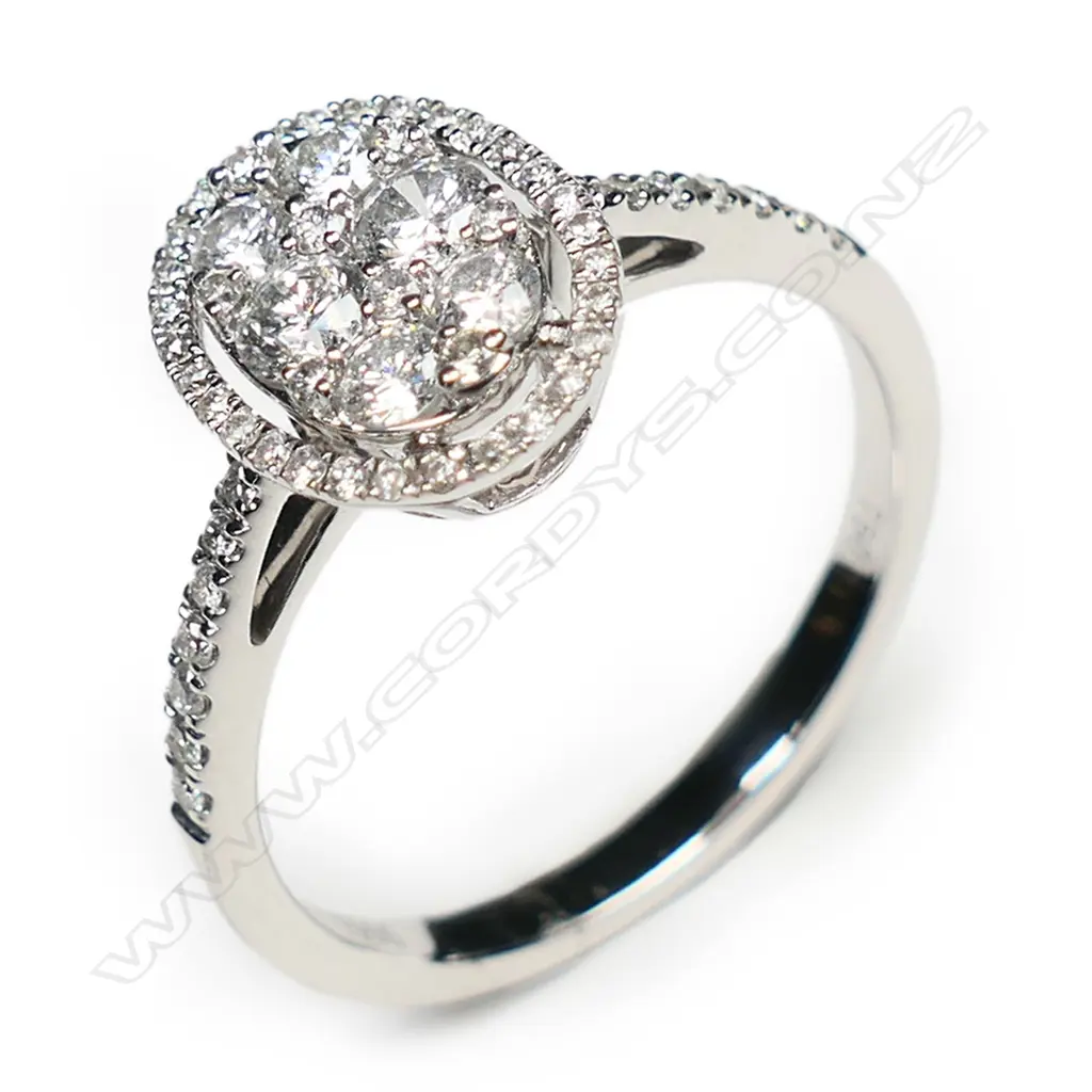 An 18ct white gold and diamond cluster ring, Image 1++