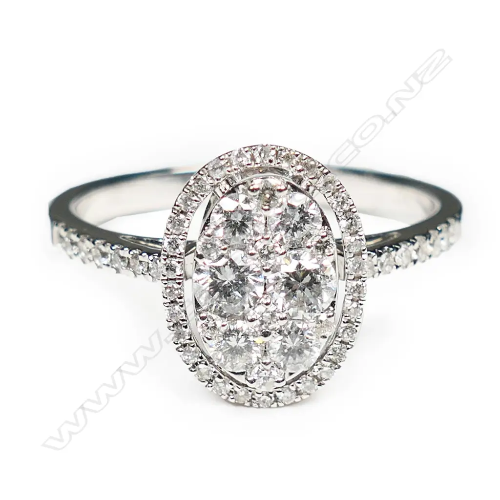 An 18ct white gold and diamond cluster ring, Image 1++
