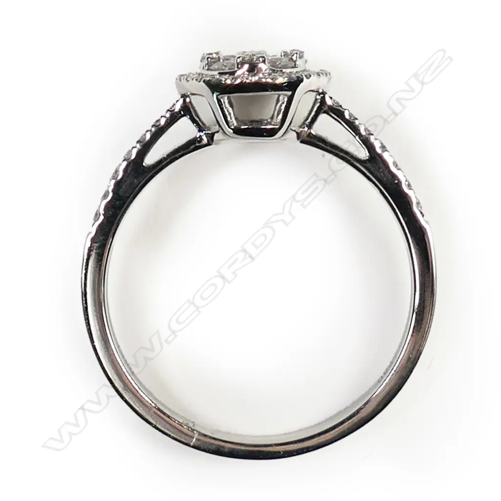 An 18ct white gold and diamond cluster ring, Image 1++