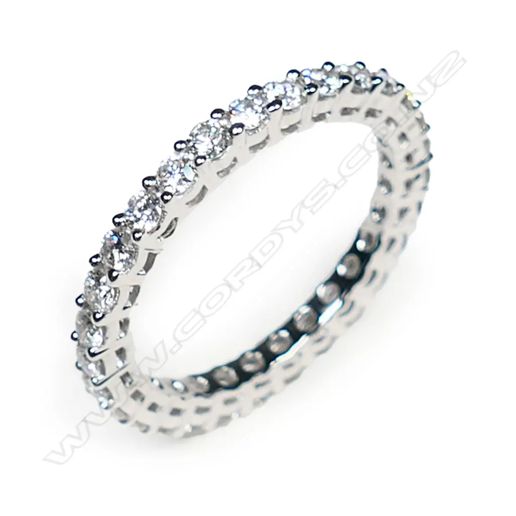 A platinum and diamond eternity band, Image 1++