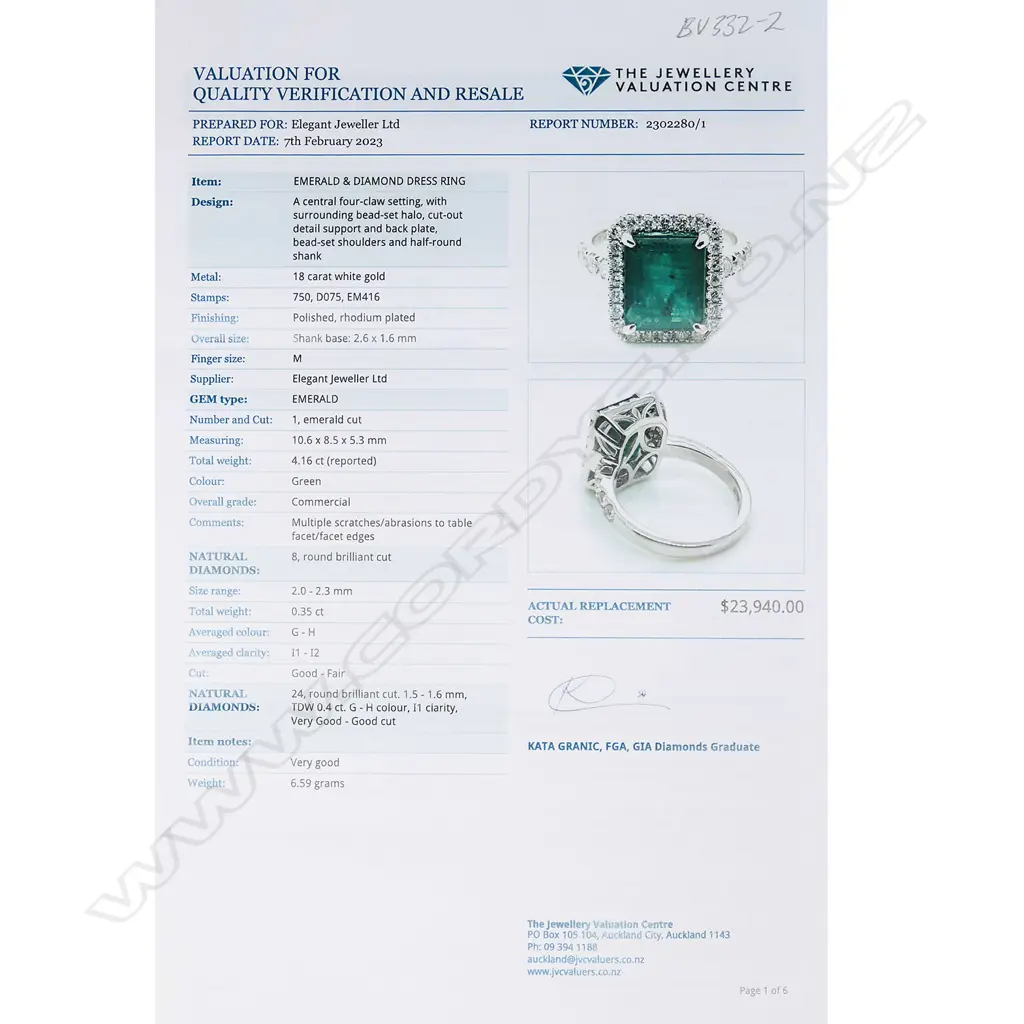 @ An 18ct white gold emerald and diamond cluster ring Image 1++