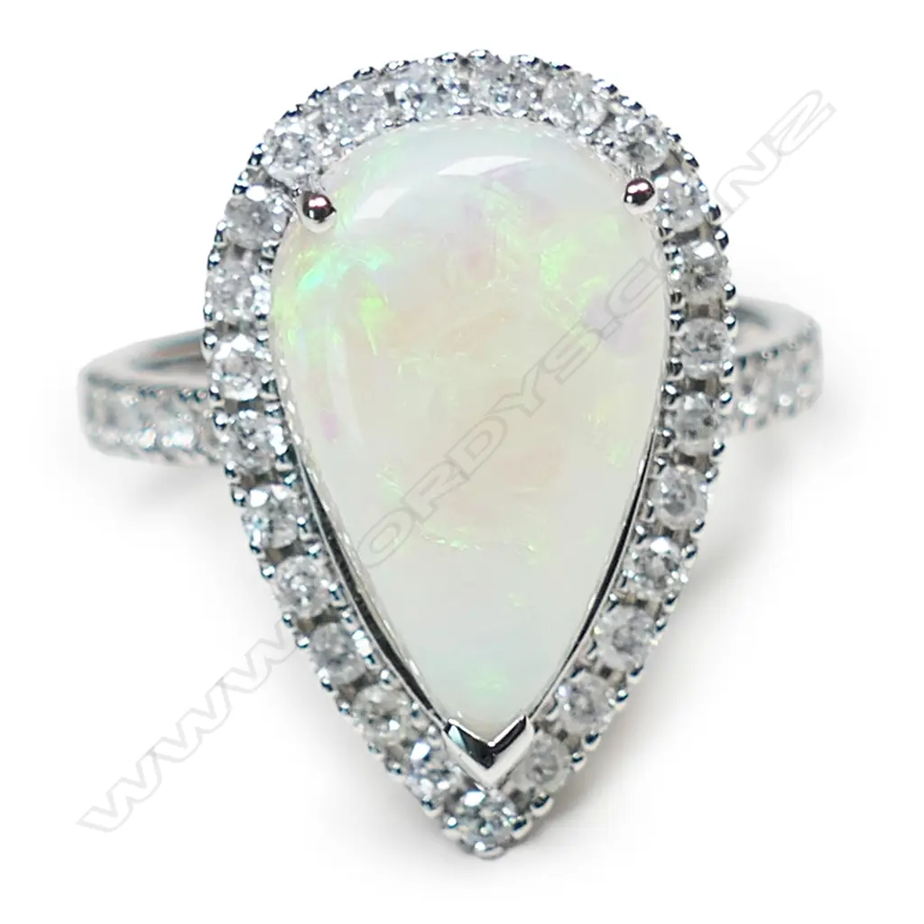 A 14ct white gold opal and diamond halo ring, Image 1++