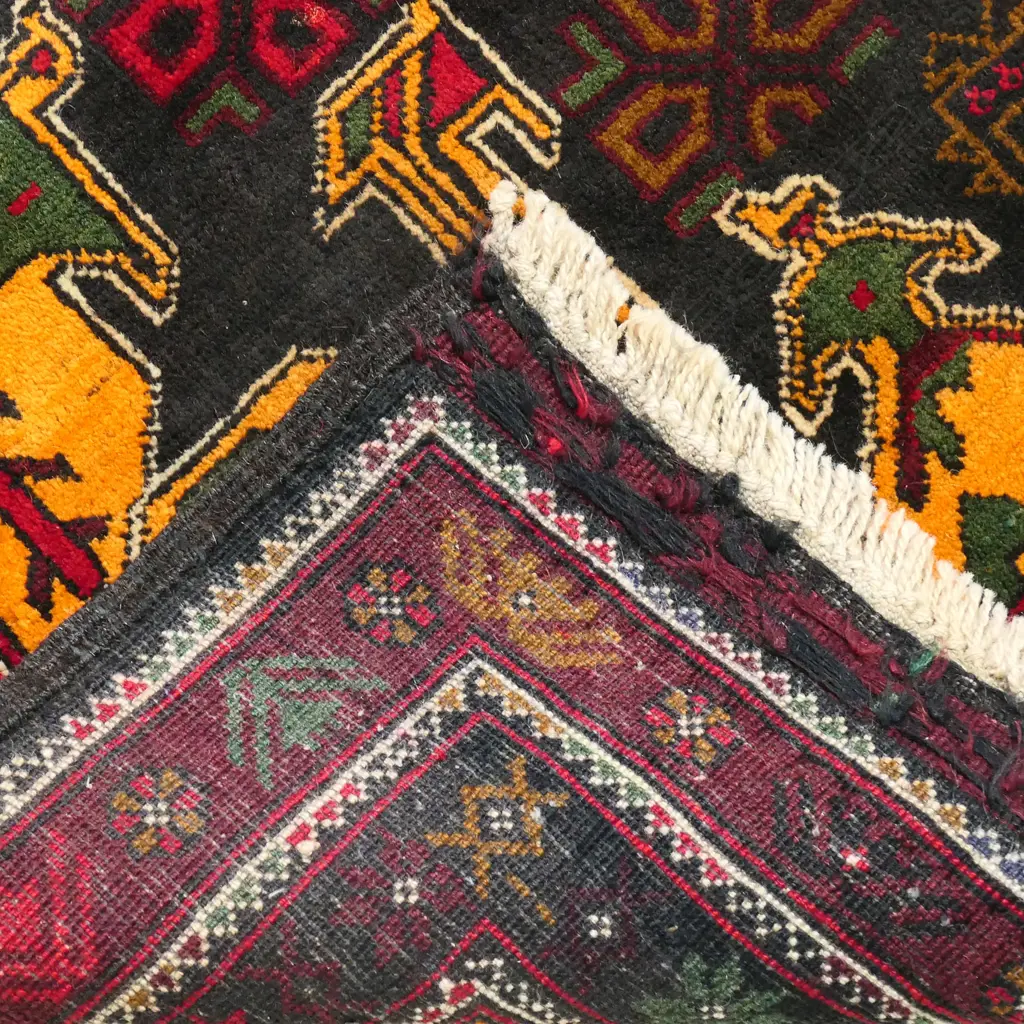 A hand knotted tribal Balouchi rug, Image 1++