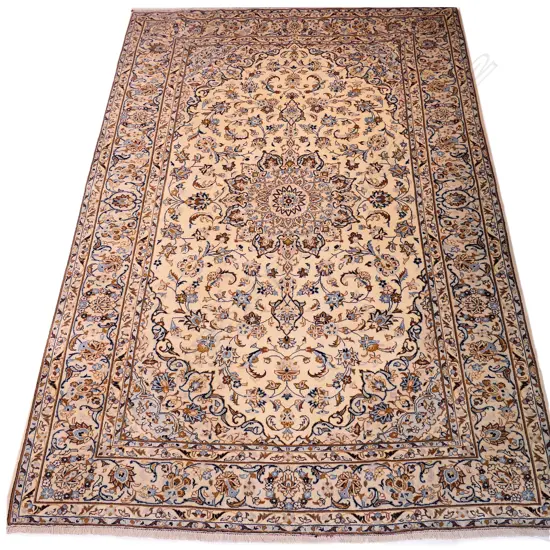 A hand-knotted Persian Kashan rug,
