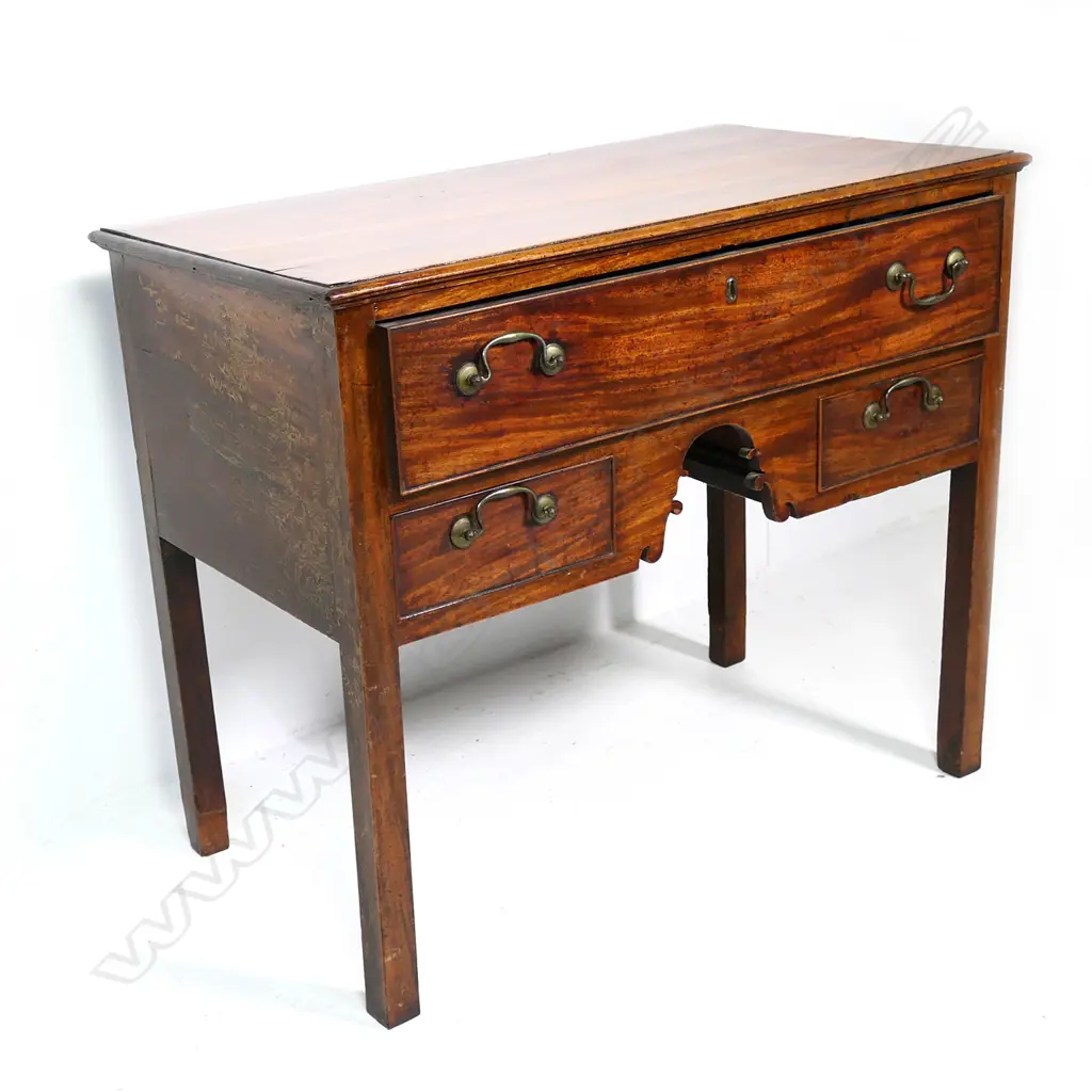 A Georgian mahogany lowboy, Image 1++