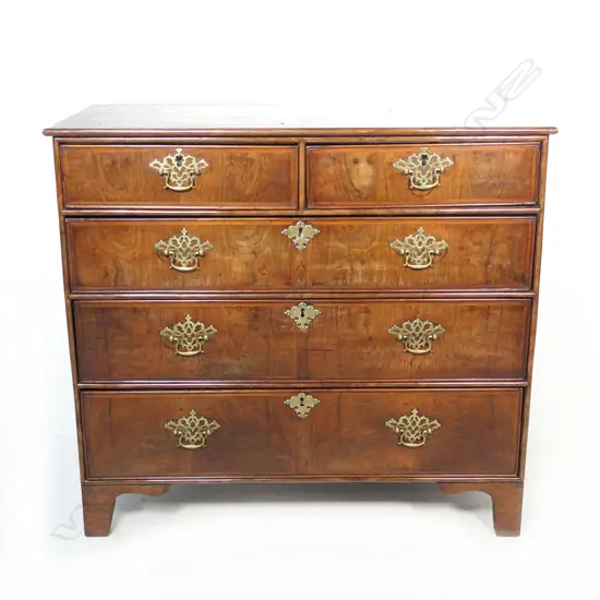 A George l and later figured walnut flat front chest,