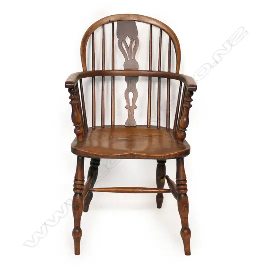 An early 19thC elm Windsor armchair,