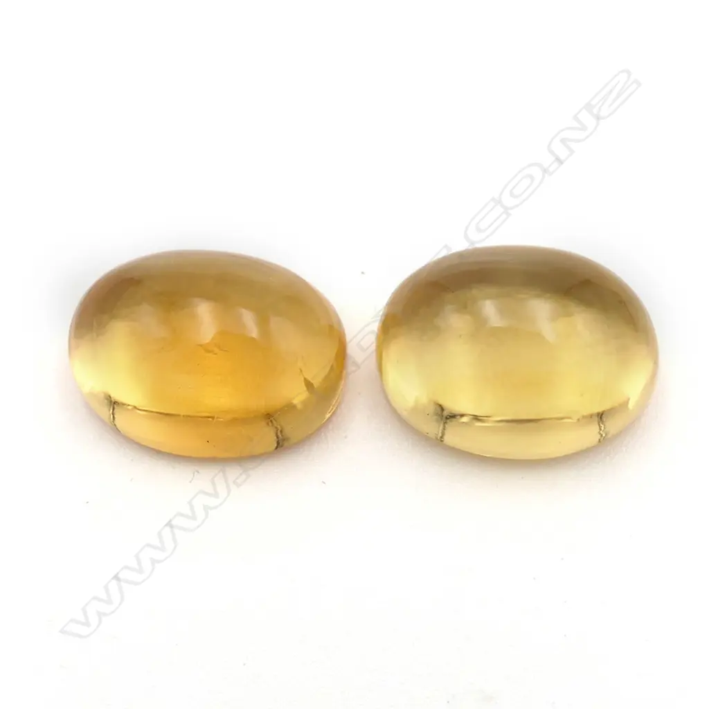 Citrine – 10.7ct. - 2 stones oval cabochon Image 1++