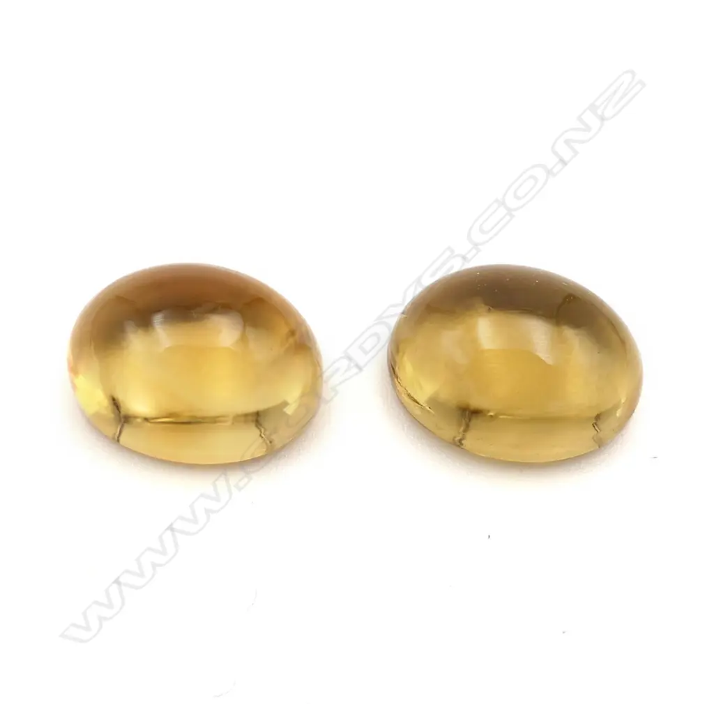 Citrine – 10.18ct. - 2 stones oval cabochon Image 1++