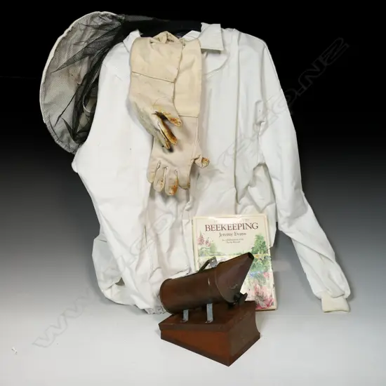 Assorted Beekeeper’s kit including: suit (top only) gloves and smoker,  plus ‘A Complete Guide to Beekeeping’ by Jeremy Evans
