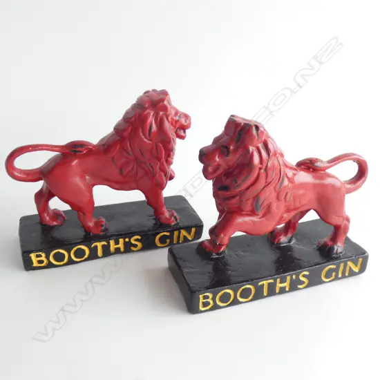 A pair of Booths Gin ceramic lions, 150 x 165mm