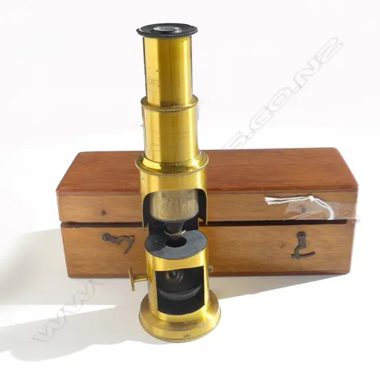 T & H Doublet Optician’s small brass monocular microscope. H.155mm. In original wooden box.