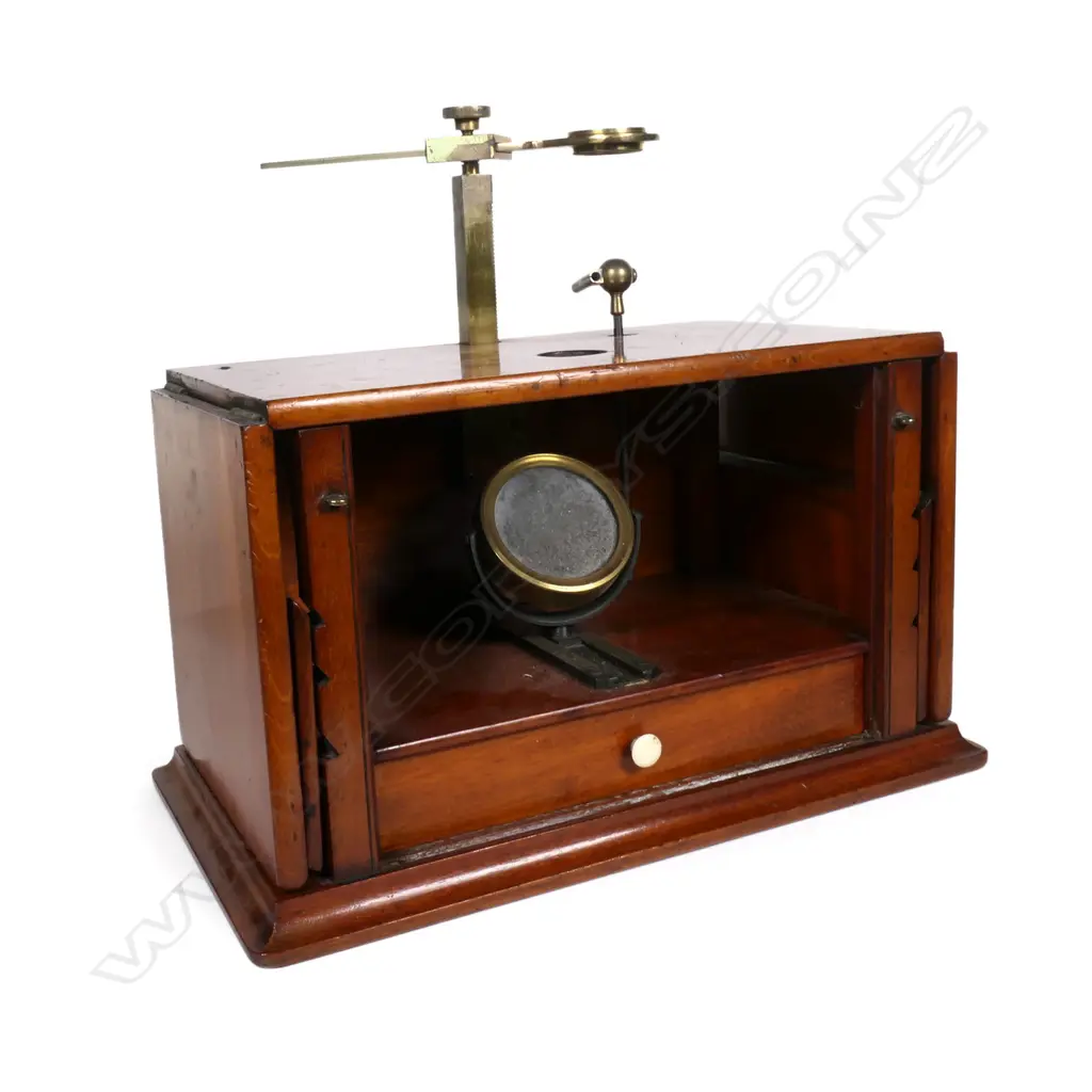 A Victorian mahogany and brass field microscope, of box type construction with adjustable hinged flap sides, rise and fall brass viewer, internal mirror and drawer containing assorted instruments and tools. 480 x 130 x 160mm. Provenance: ex The Jack Thornton estate collection. Image 1++