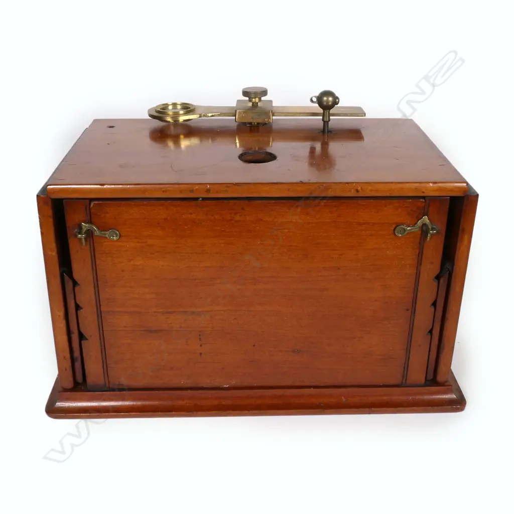 A Victorian mahogany and brass field microscope, of box type construction with adjustable hinged flap sides, rise and fall brass viewer, internal mirror and drawer containing assorted instruments and tools. 480 x 130 x 160mm. Provenance: ex The Jack Thornton estate collection. Image 1++