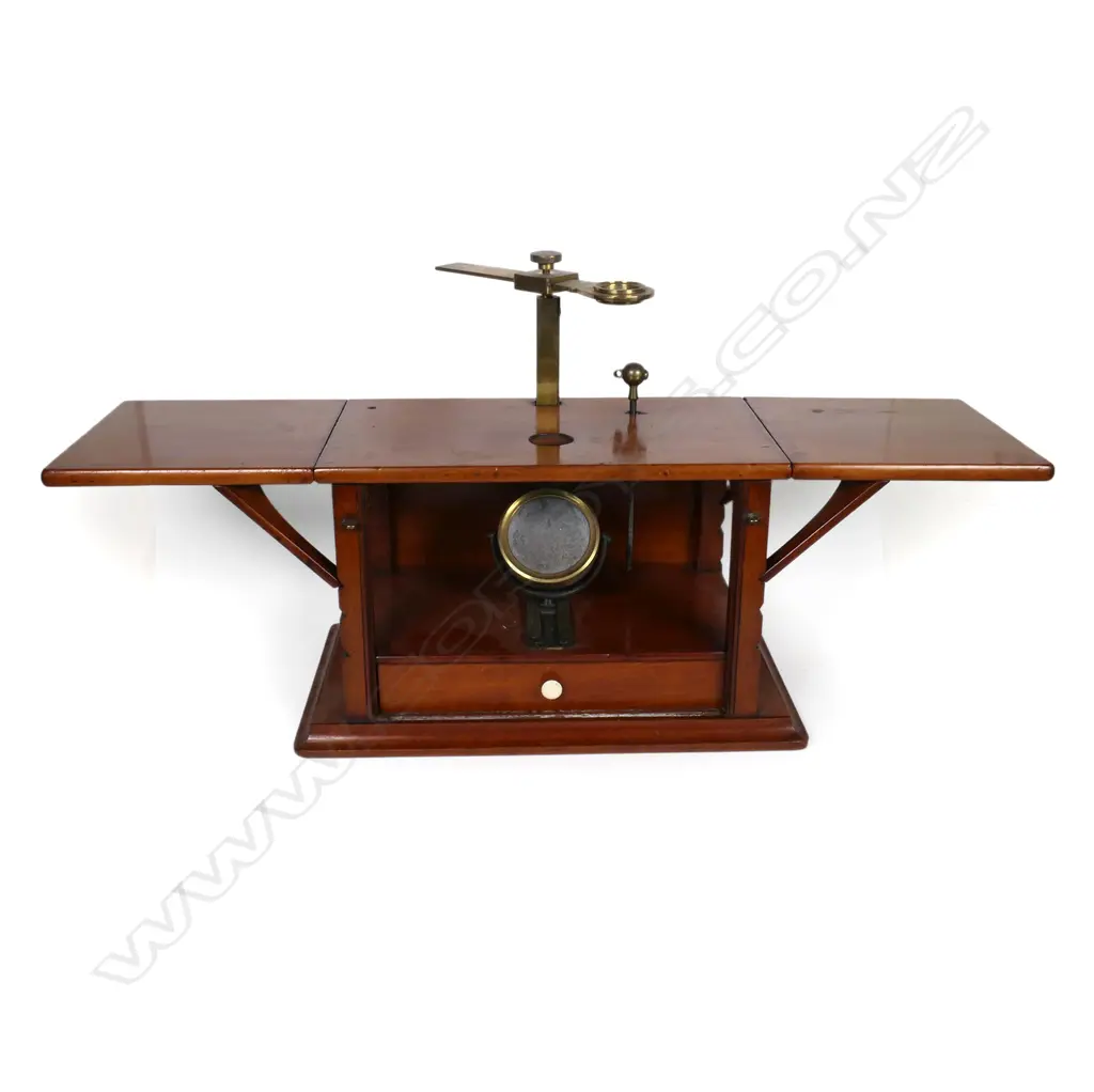 A Victorian mahogany and brass field microscope, of box type construction with adjustable hinged flap sides, rise and fall brass viewer, internal mirror and drawer containing assorted instruments and tools. 480 x 130 x 160mm. Provenance: ex The Jack Thornton estate collection. Image 1++