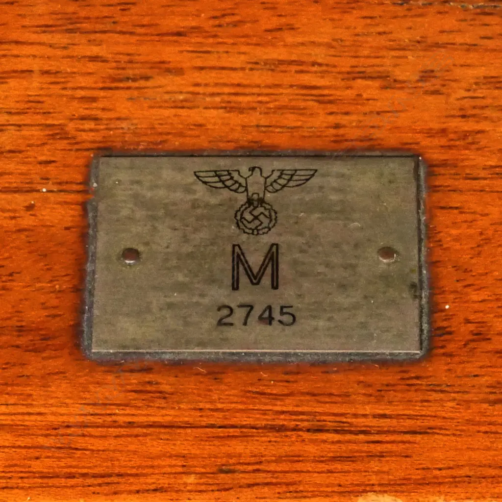 A WW2 German military barograph, in mahogany case with three glazed panels, the cover with small plaque engraved with a swastika above 'M' above '2745', the front with plaque engraved 'Presented by Lieut. Comdr S.C. Bradley RNR'. 285 x 140 x 165mm. Provenance: ex The Jack Thornton estate collection. Image 1++