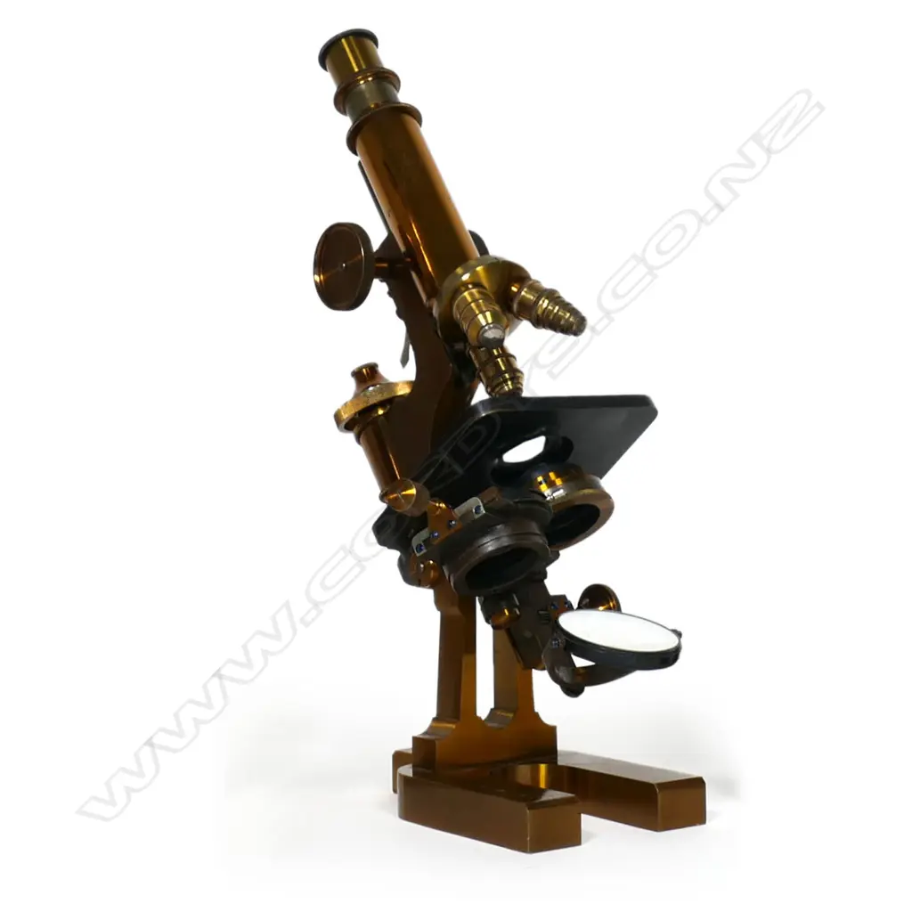 An Ed. Messter of Berlin lacquered brass compound microscope, rectangular horseshoe base, slotted pillar, tubular limb with triangular rod, topped by fine adjuster. Substage lens, iris diaphragm and double mirror. Body tube with double milled head pinion, triple objective lens swivel cluster. Signed and dated 1894 under the base. Provenance: ex The Jack Thornton estate collection. Image 1++