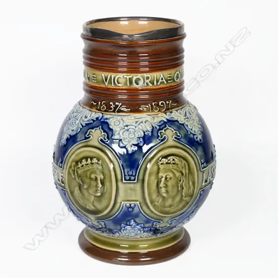 Doulton Lambeth Queen Victoria jug with sterling silver rim. H.190mm