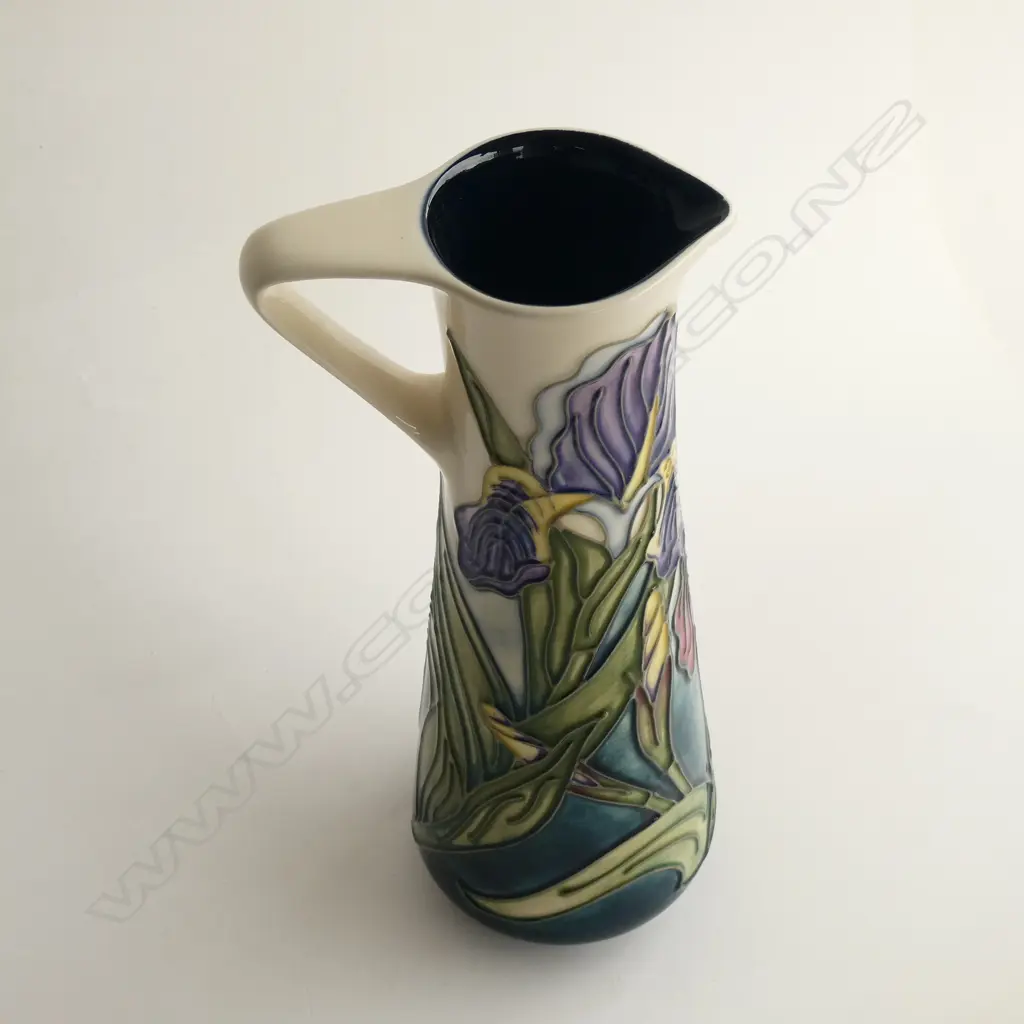 A boxed Moorcroft jug, Iris pattern, designed by Rachael Bishop c.1996 for the Moorcroft Collectors Club, shape JU3, 1951. H.240mm Image 1++