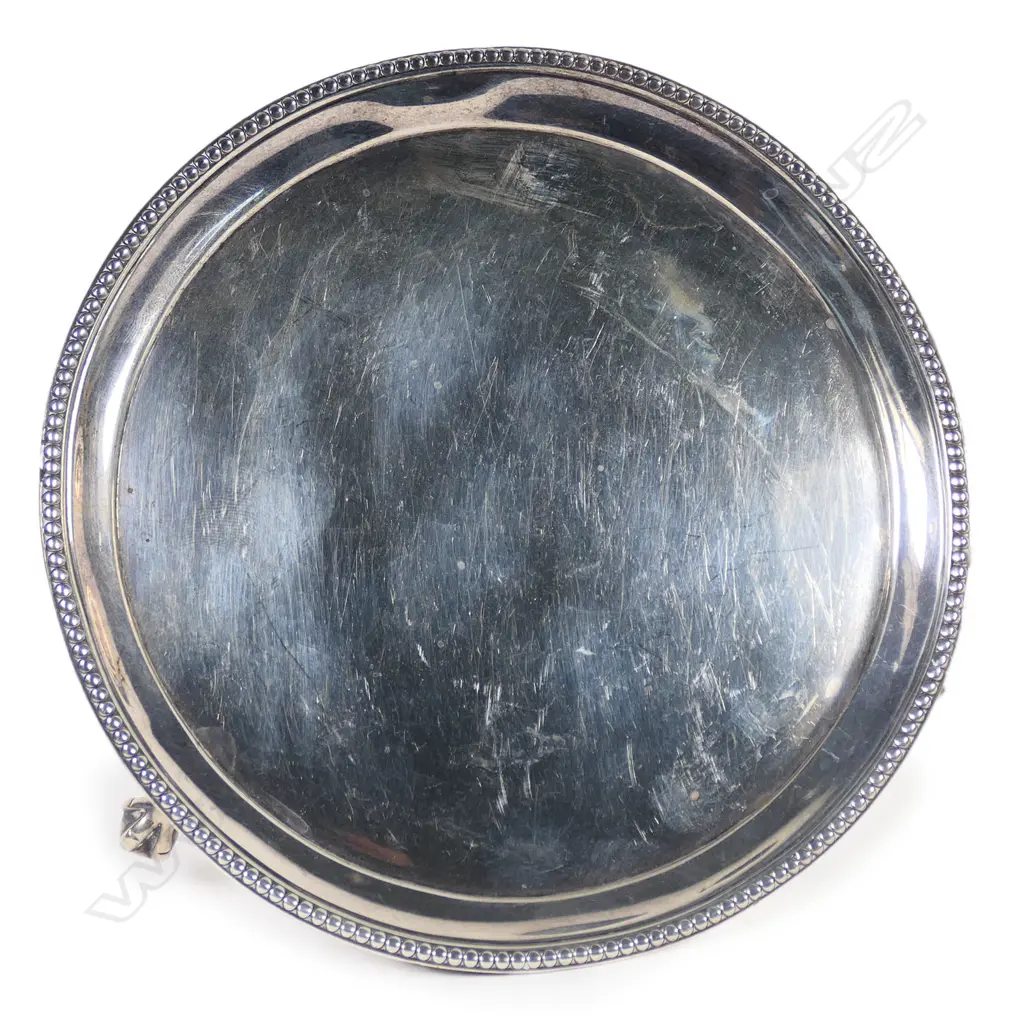 A George III silver waiter of plain circular form with bead rim. Raised on three ball and claw feet. London 1794. Dia.142mm. 158gm. Image 1++