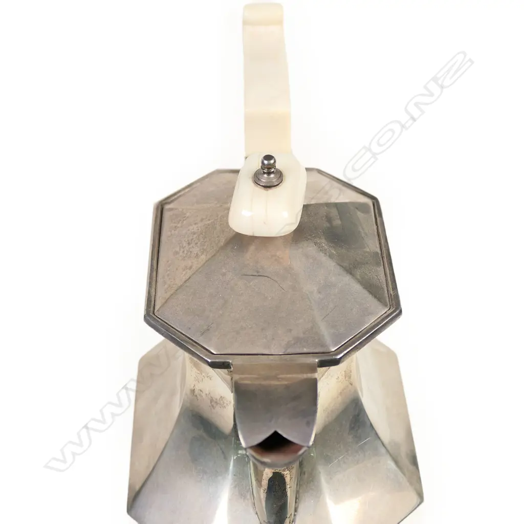 An Art Deco silver hot water pot with ivory handle and finial, octagonal baluster shape with conforming lid and spreading foot. Sheffield 1935 by Viners Ltd. 665gm Image 1++