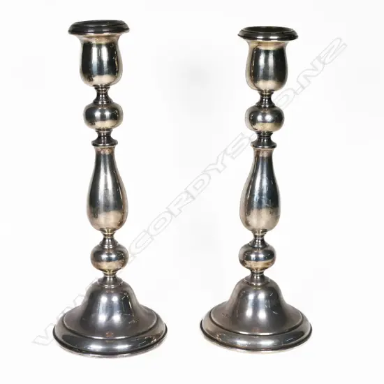 A pair of silver Birmingham baluster column candlesticks. H.275mm. Weighted bases.