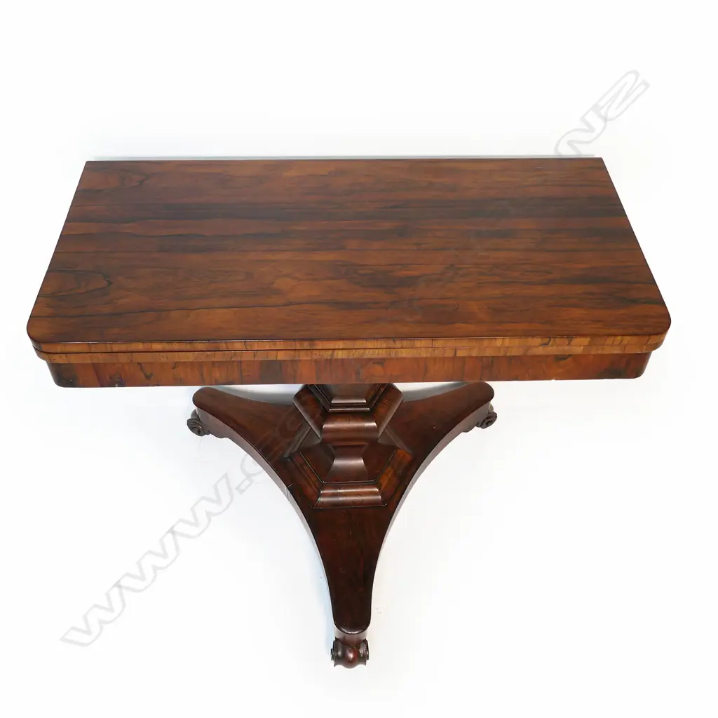 A Regency rosewood supper table,  flap top, raised on a hexagonal baluster column and tripod base with scrolling feet. Image 1++