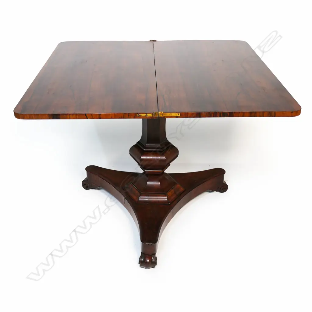 A Regency rosewood supper table,  flap top, raised on a hexagonal baluster column and tripod base with scrolling feet. Image 1++