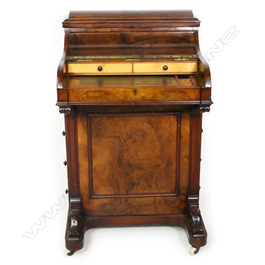 A good Victorian figured walnut davenport, the top with rise and fall stationery compartment, the front hinged lid with sliding and fitted interior, leather insert, traditionally with four drawers to the right side. H.910mm Image 1++
