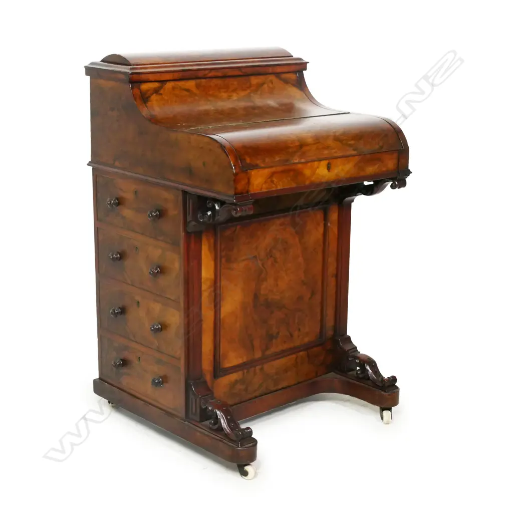 A good Victorian figured walnut davenport, the top with rise and fall stationery compartment, the front hinged lid with sliding and fitted interior, leather insert, traditionally with four drawers to the right side. H.910mm Image 1++