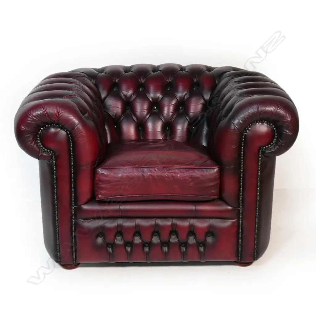 A pair of Gascoigne Chesterfield tub chairs, upholstered in burgundy leather with button-backs. 1100 x 940 x 760mm. Handmade by Gascoigne Leather Centre - an Australian furniture company. Image 1++