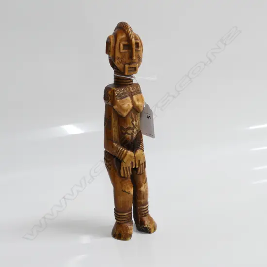 YORUBA BENIN ERE IBEJI SOLID IVORY CARVED FEMALE FIGURE dark staining H.210mm.