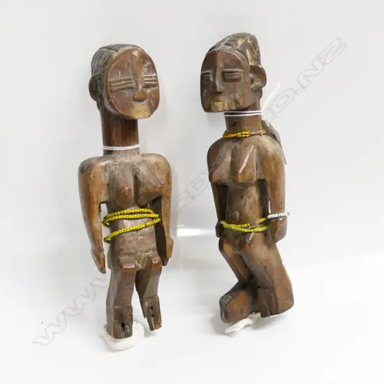 PR 'TWINS' YORUBA BENIN ERE IBEJI WOOD CARVED FIGURES with yellow beads. Some faults H.210mm