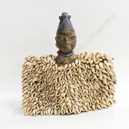 YORUBA BENIN ERE IBEJI WOOD CARVED FIGURE with multi shell cloak/drape. W.280mm. H.275mm.