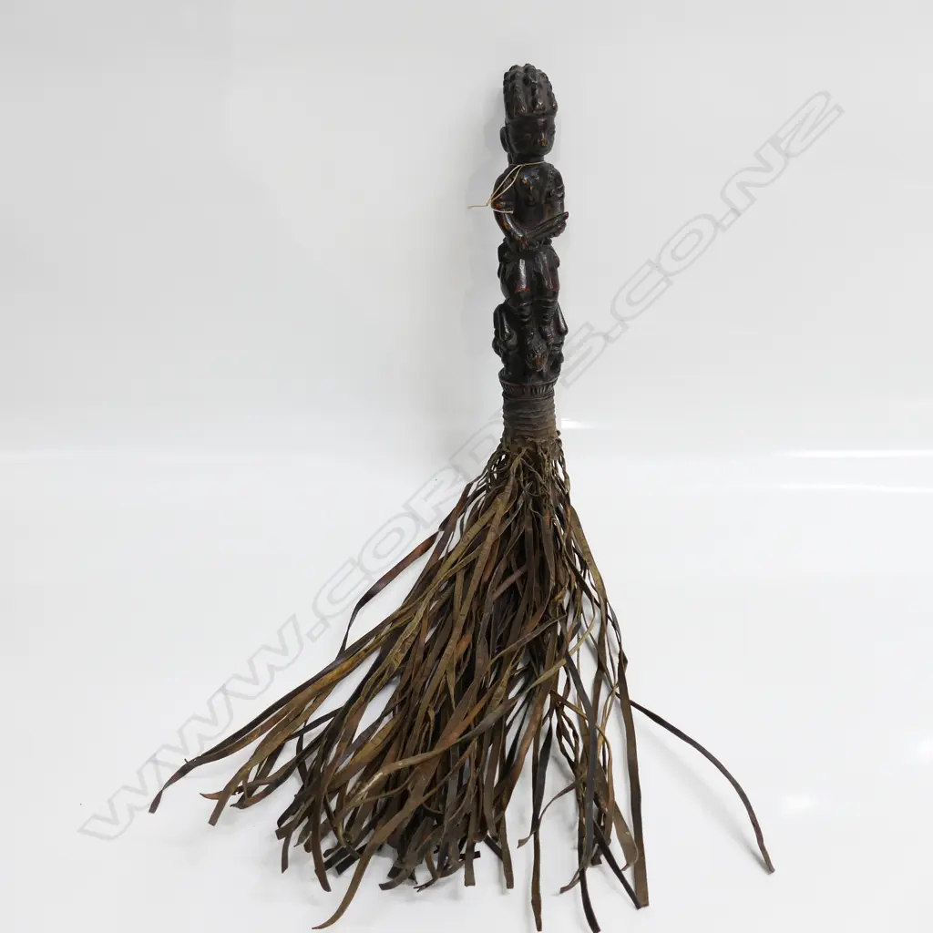 AFRICAN YORUBA CARVED FIGURE HANDLED LEATHER FLY WHISK. The figure with firearm, L.640mm Image 1++